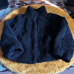 Teddy jacket, black with lining, broken zipper it won’t zip up.